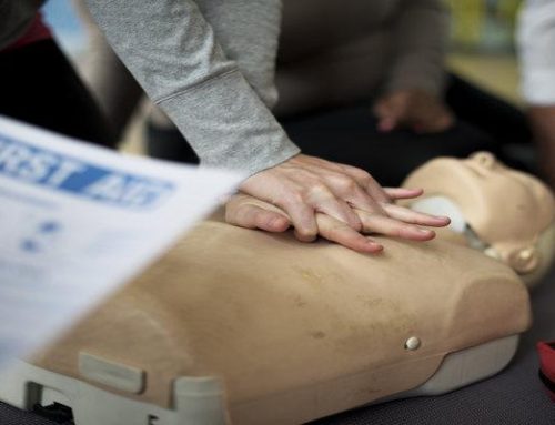 How do I qualify as a First Aid Trainer?